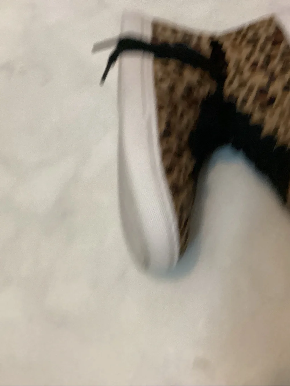 Kate Spade scallop leopard sneakers.